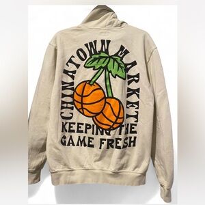 Chinatown Market Beige Hoodie with Orange Graphic